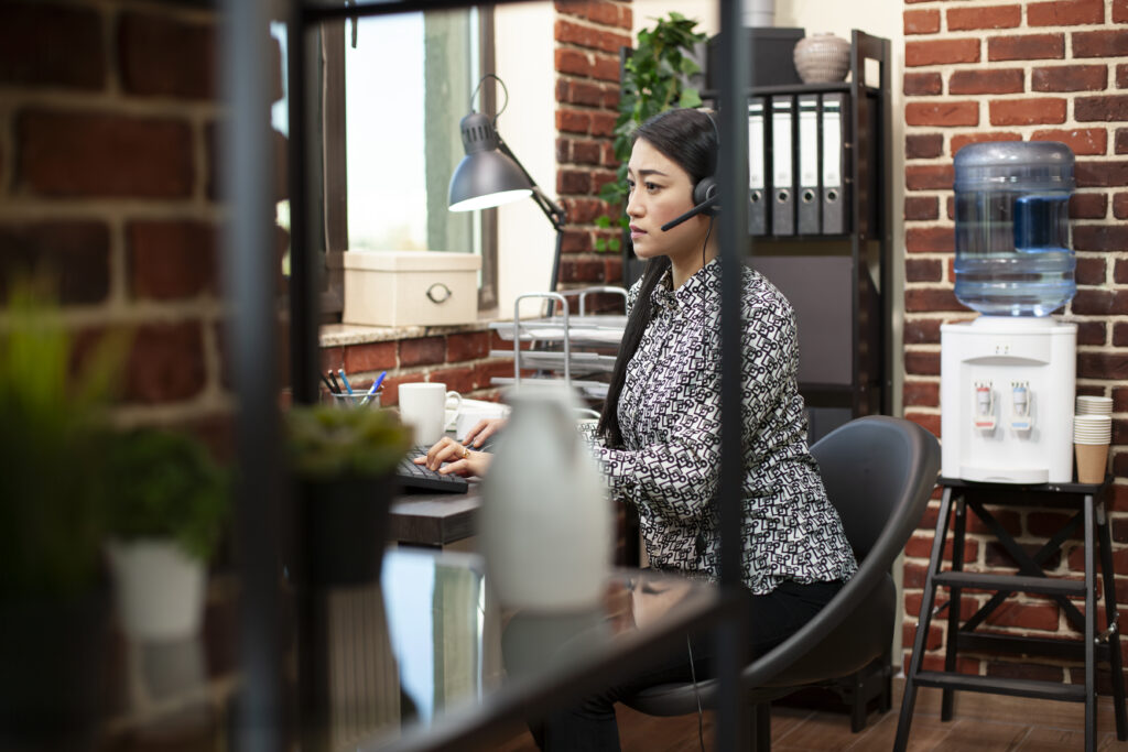 Telemarketing executive explaining telesales executive duties during a client call