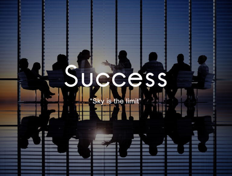 Sales team working together with a motivational leader during a meeting